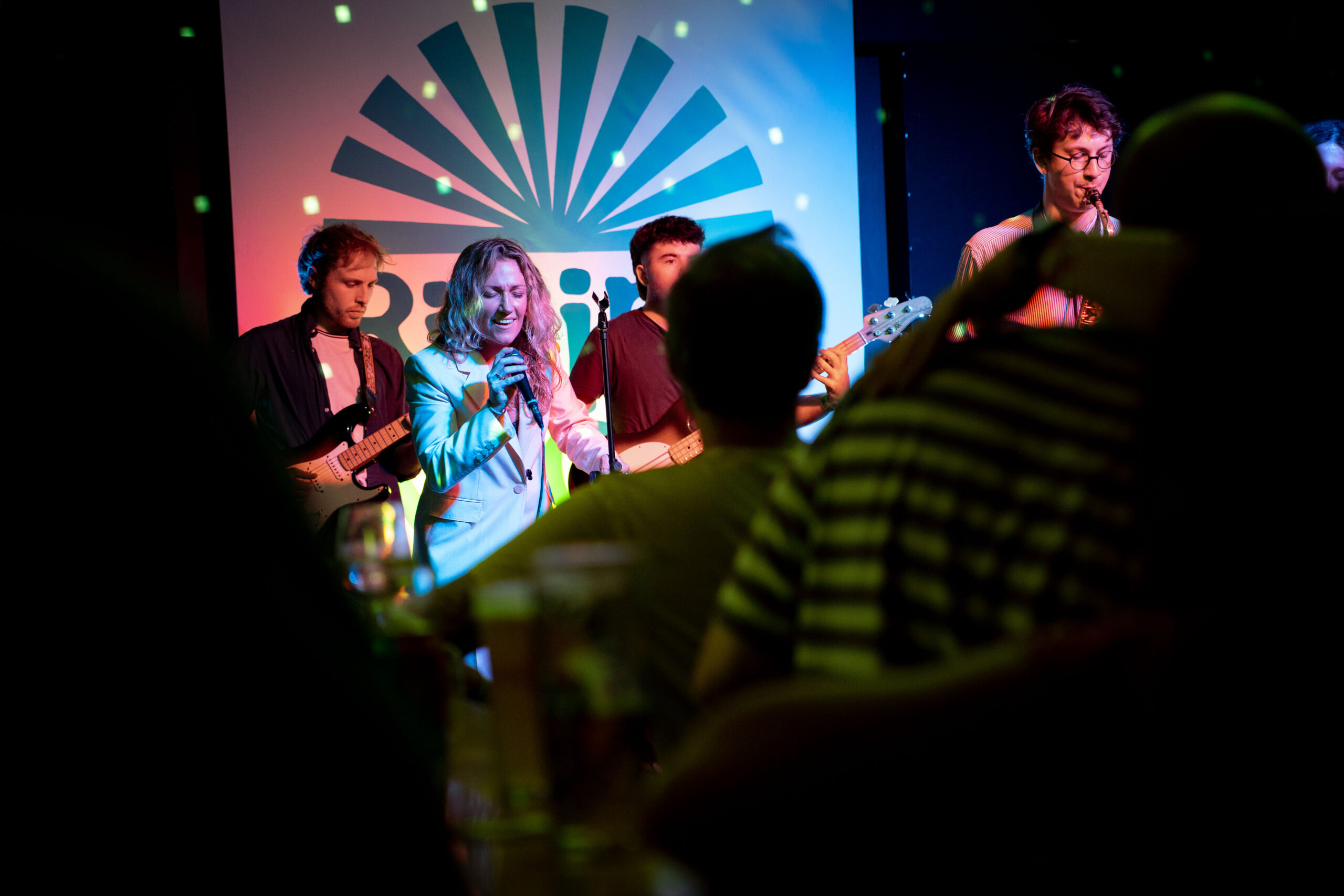 A band performing on stage at The Bread & Roses